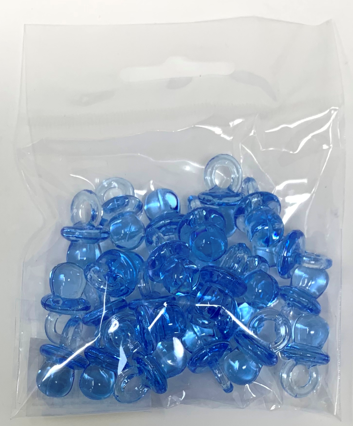 Bomboniera Ciuccio in Plastica Celeste Cm. 2; Conf. da 24 Pezzi Nascita e Battesimo